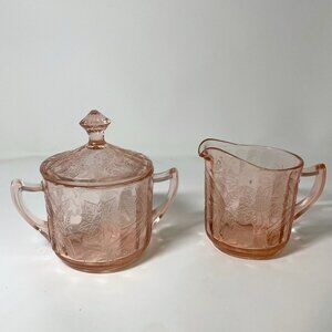 Cream and sugar set, pink poinsettia pattern by Jeannette Glass